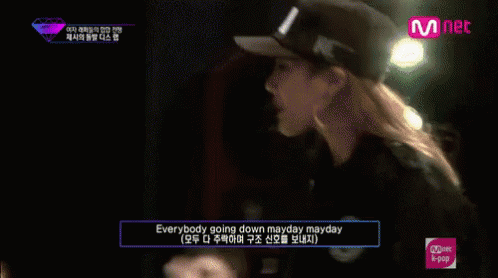 Group Sitting In Front Of Mnet Sign GIF