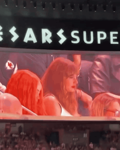 Group Sitting in Front of Sarssupe Sign