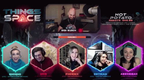 Group Sitting In Front Of Space Sign GIF