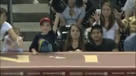 Group Sitting in Stadium Watching Game