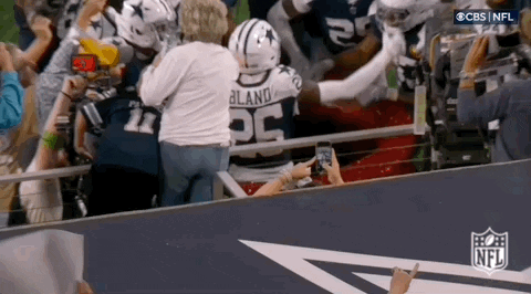 Group Sitting On Couch In Front Of Baddies Reunion Sign GIF