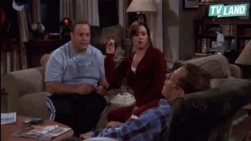 Group Sitting on Couch With TV Land Sign