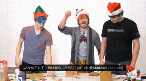 Group Standing Around Table Saying Can We Hit 1 Billion Likes GIF