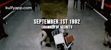 Group Standing By Sign Saying September 1st 1992 Chamber Of Secrets