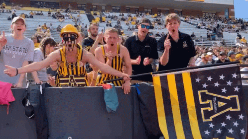Group Standing In Front Of App State University Banner GIF