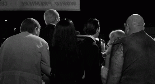 Group Standing In Front Of Mosko Brewiere Sign GIF