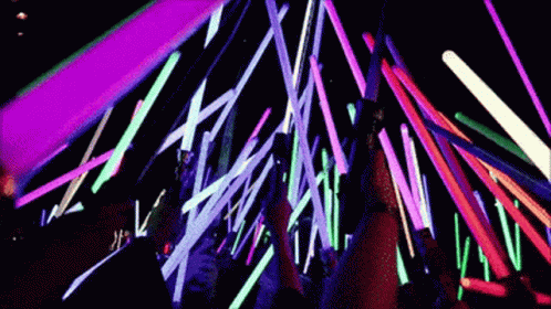 Group Standing in Front of Neon Lights