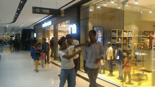 Group Standing In Front Of Pepe Jeans Store GIF