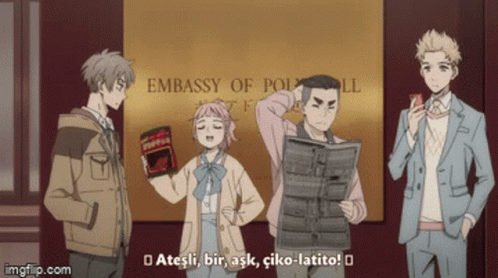 Group Standing In Front Of Polwell Embassy Sign GIF