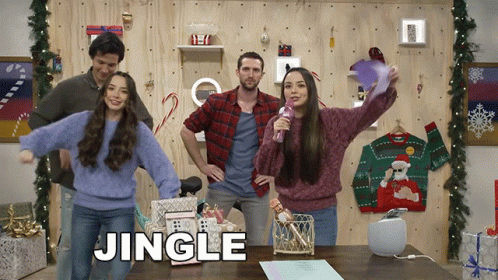 Group Standing in Front of Wall Saying Jingle