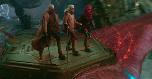 Group Standing on Red Surface