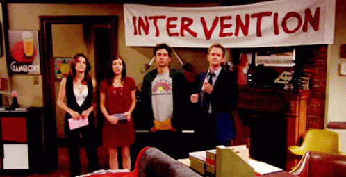 Group Standing Under Intervention Banner GIF