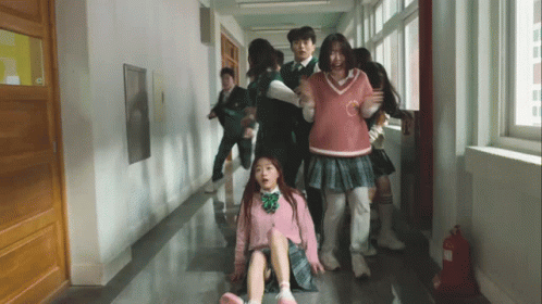 Group Walking Down Hallway with Fire Extinguisher