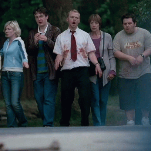 Group Walking Down Street, One Wearing I'm Very Wanted GIF