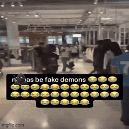 Group Walking In Store With Sign Saying N'as Be Fake Demons GIF