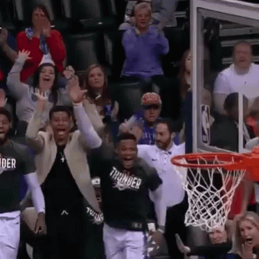 Group Watching Basketball Player in Thunder Shirt