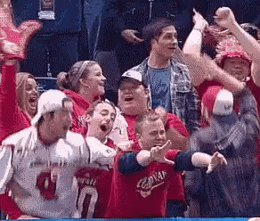 Group Watching Game Person in Red Jersey Number 10
