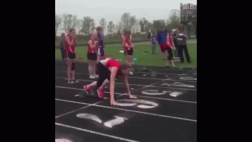 Group Watching Runner On Track GIF