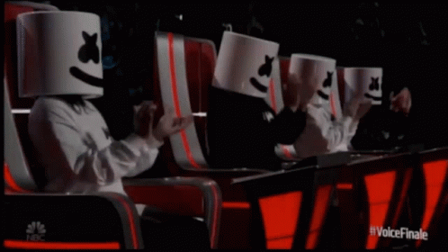 Group Wearing Marshmallow Hats Sitting In Chairs GIF