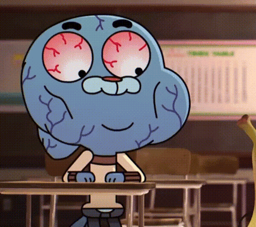 Gumball Sitting at Desk in Classroom