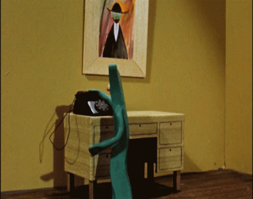 Gumby Cartoon Character Making Phone Call GIF