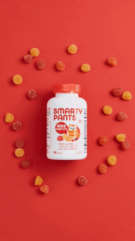 Gummies Scattered Around Bottles GIF