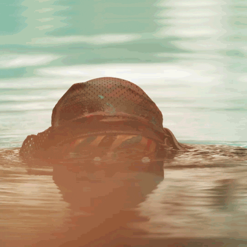 Gunner Biting His Gun In Water GIF