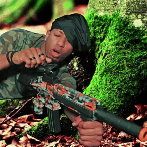 Gunner Lying Down Behind A Tree GIF