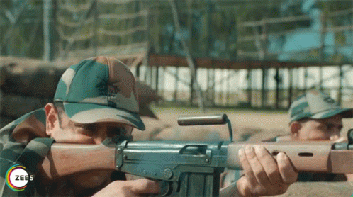 Gunner Lying On His Stomach While Firing GIF