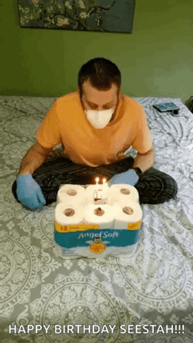 Guy Blows Candle Of Toilet Paper Cake GIF