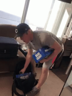 Guy Carrying Two Bud Light Boxes GIF
