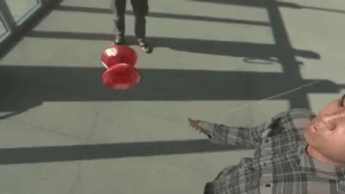 Guy Catching Yo Yo In The Air GIF