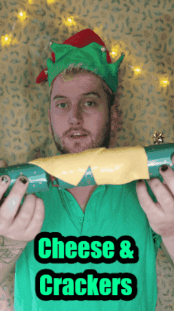 Guy Christmas Elf Cheese And Crackers GIF