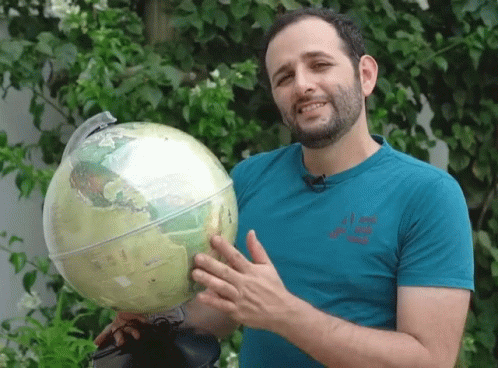 Guy Discussing Globe Features GIF