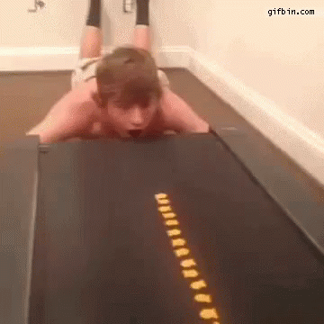 Guy Eating On A Treadmill GIF