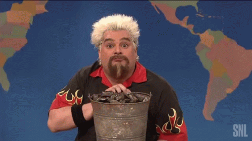 Guy Fieri Holding A Bucket Of Charcoal GIF