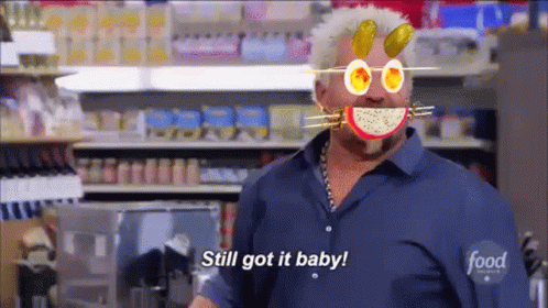 Guy Fieri With A Stick And Pickles On His Forehead GIF