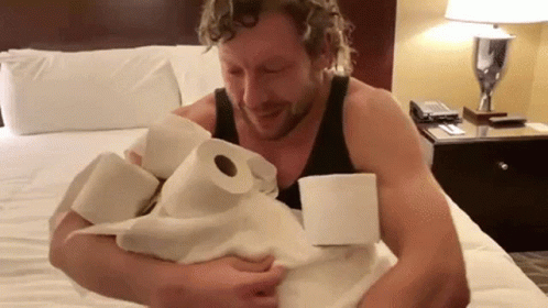 Guy Holds Toilet Paper In His Arms GIF