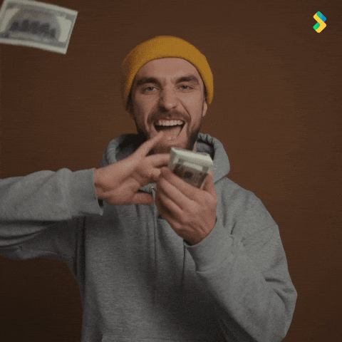 Guy In Gray Hoodie Shoving Cash Spend Money GIF