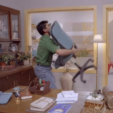 Guy In Green Dancing With Chair GIF