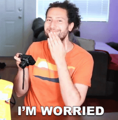 Guy Looking At Pictures Worried Reaction GIF