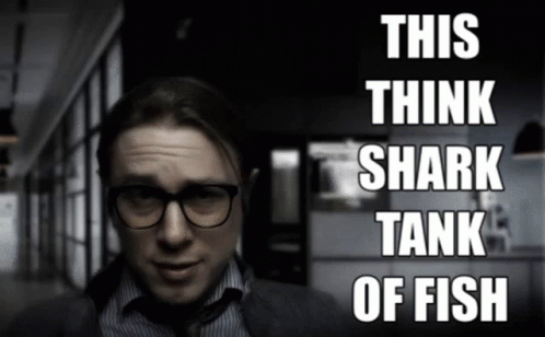 Guy Mouthing Shark Tank Of Fish GIF