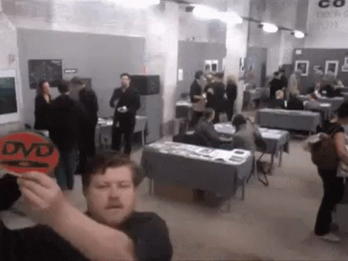 Guy Moving Around The Dvd GIF