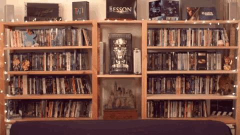 Guy Peeking In The Library GIF