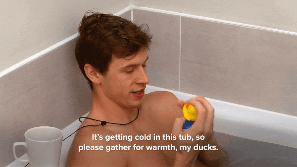 Guy Plays Rubber Duckies Bath Time GIF