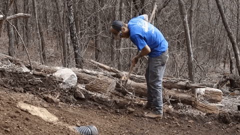 Guy Raking Mulch To The Side GIF