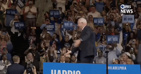 Guy Runs Hugs Harris Walz GIF