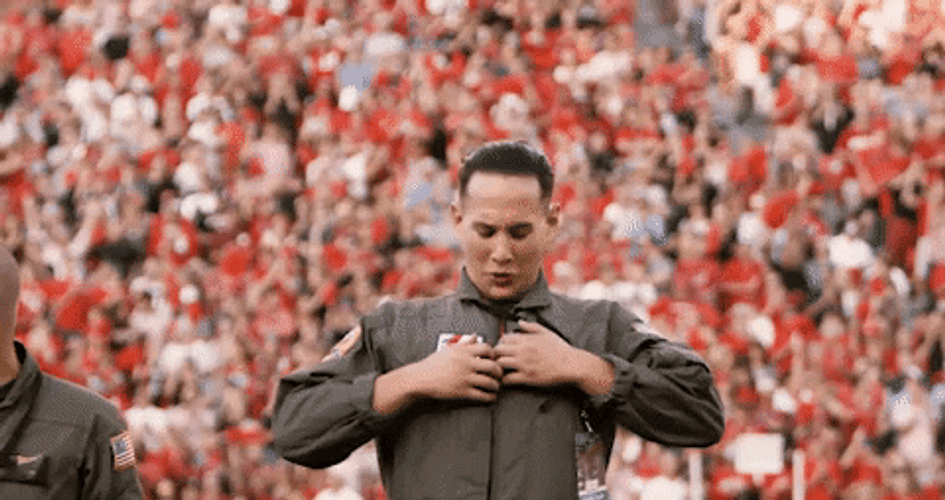 Guy Showing His Dawgs Tshirt GIF