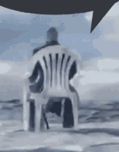 Guy Sitting In White Plastic Chair GIF