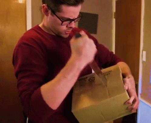 Guy Stabbing A Small Box GIF